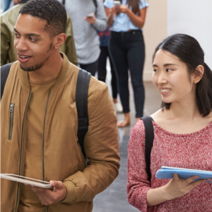 Students smiling while they are walking.